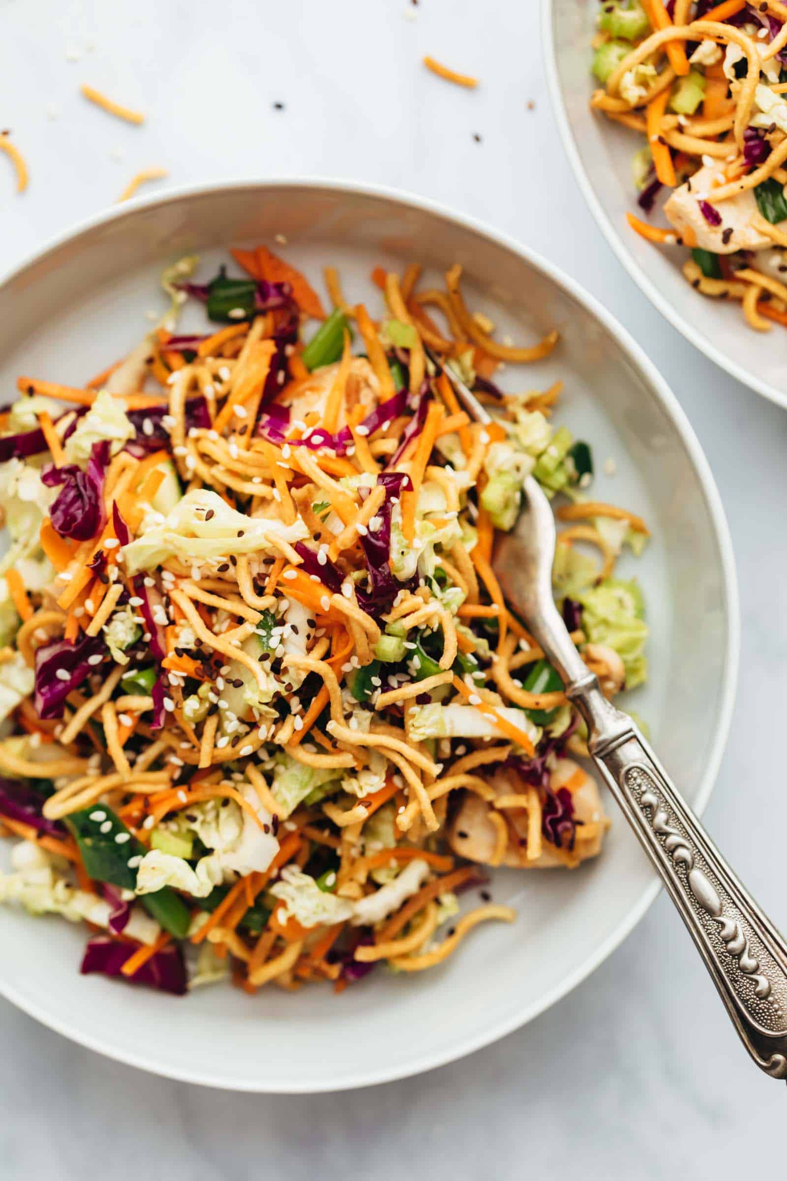 Crunchy Chinese chicken salad served in a bowl with a fork