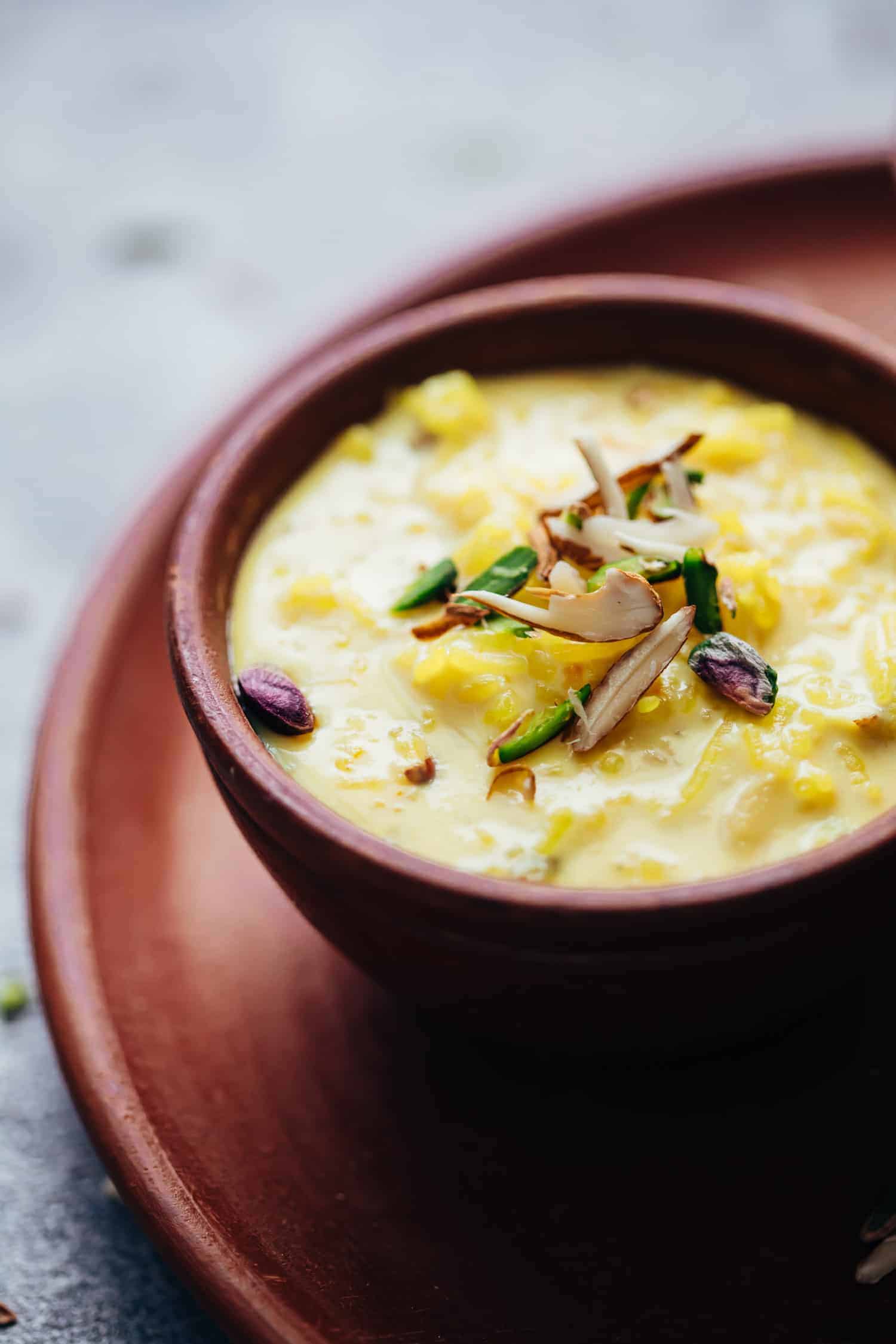 Closeup of rice kheer served in a mud pot