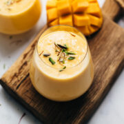 Two glasses of thick and creamy mango lassi