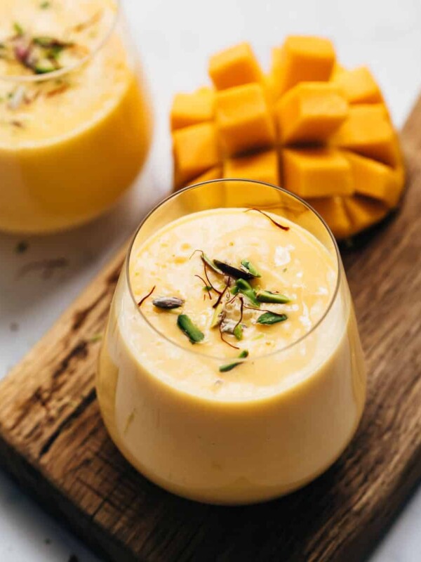 Two glasses of thick and creamy mango lassi