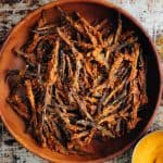 Baked kurkuri bhindi in a brown bowl