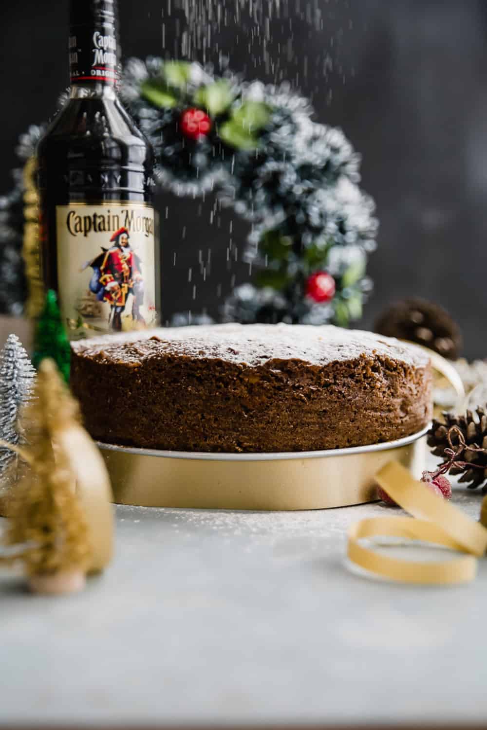 Last minute plum cake or christmas fruit cake set up on the table for slicing