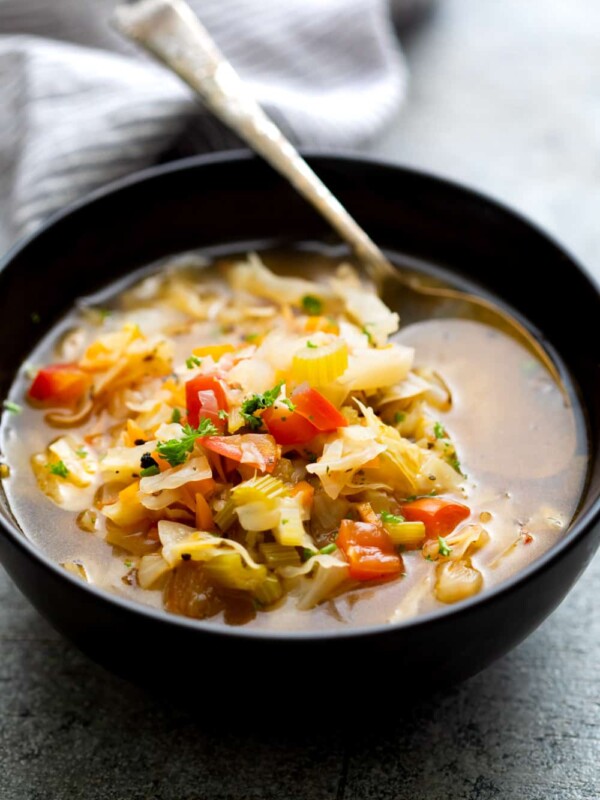 Detox cabbage soup served in a black bowl