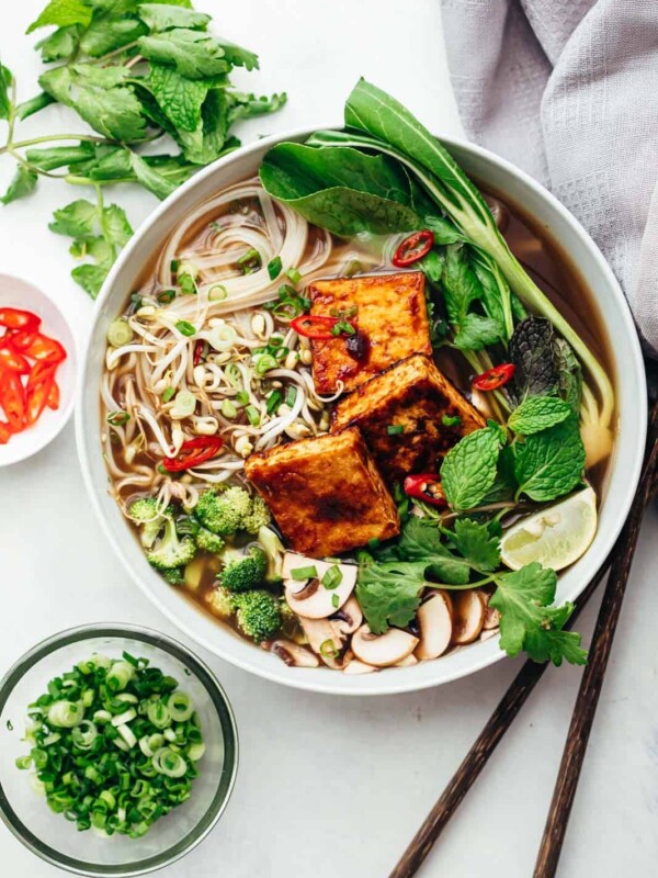 Vegetarian pho soup served in a bowl with lots of toppings
