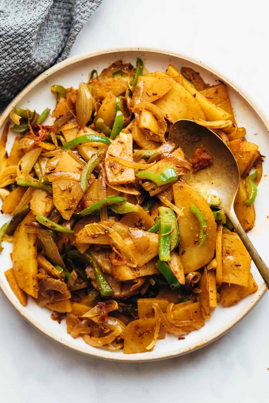 Quick aloo capsicum served in a bowl