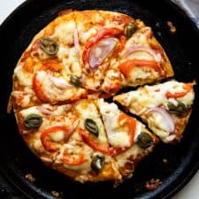 No yeast Pizza cooked on a cast iron skillet