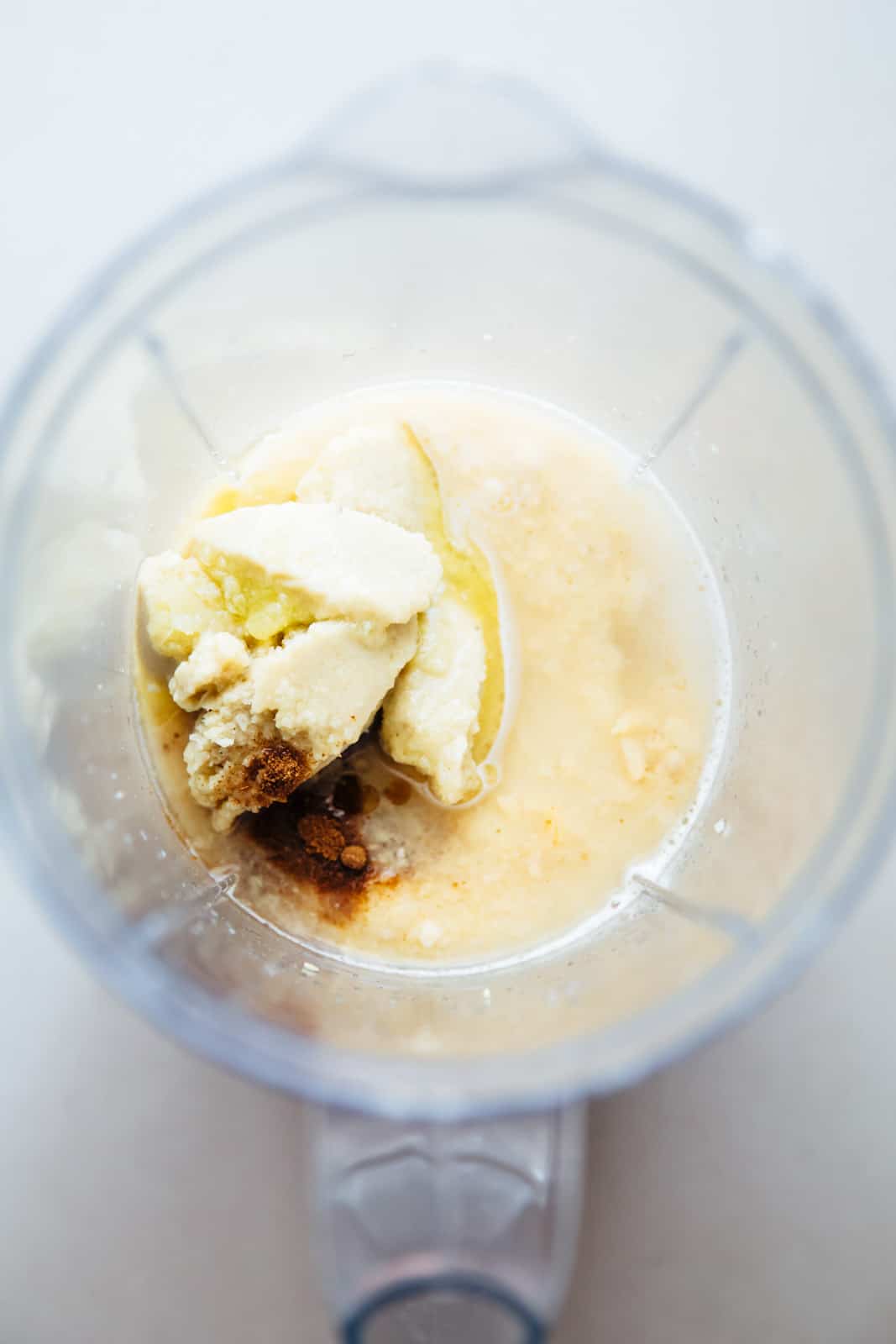 Add tahini, paprika, cumin and water to blender