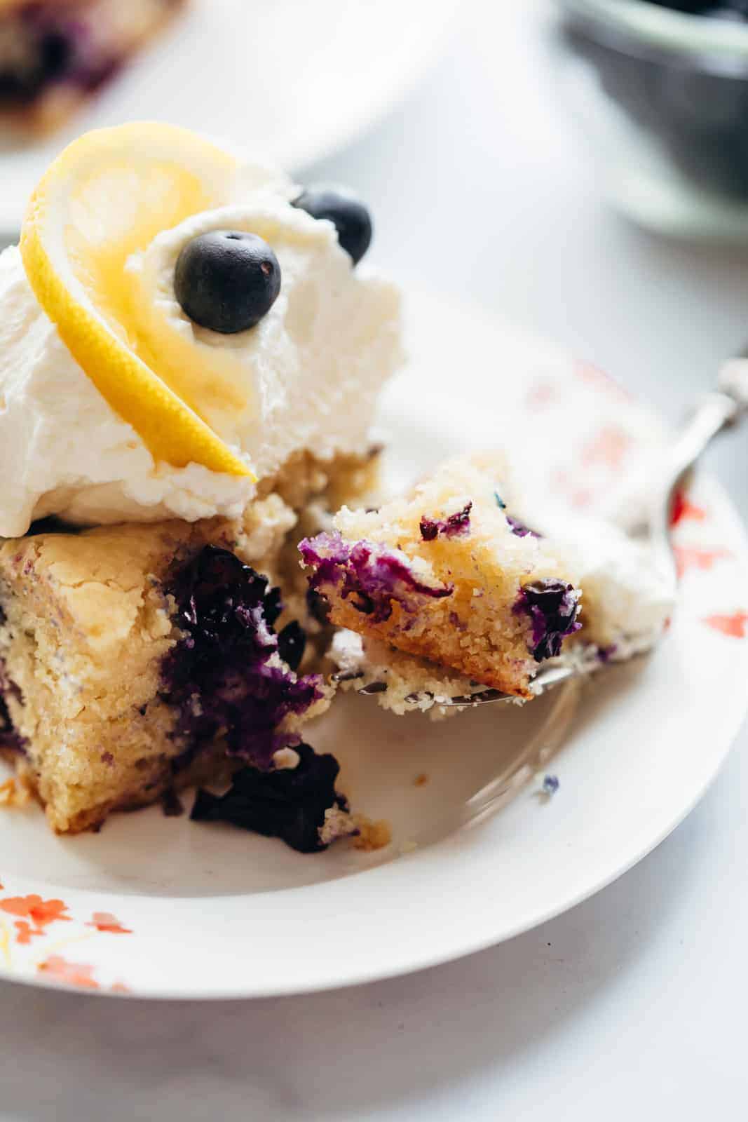 Closeup of a bite of lemon blueberry cake bars