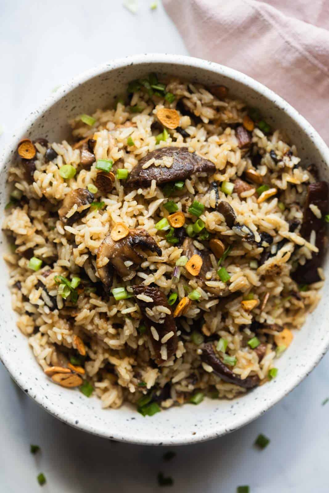Burnt garlic mushroom fried rice served in a white bowl