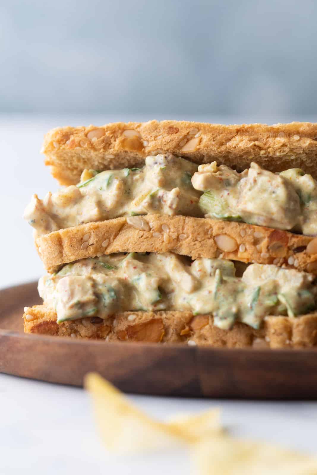 Closeup of curry chicken salad sandwich on a plate
