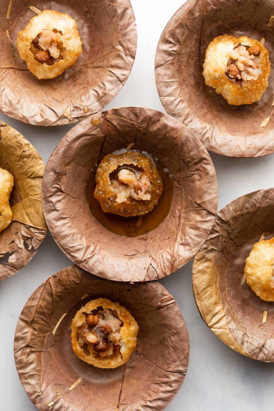 Pani puri served in traditional pattals or leaf bowls