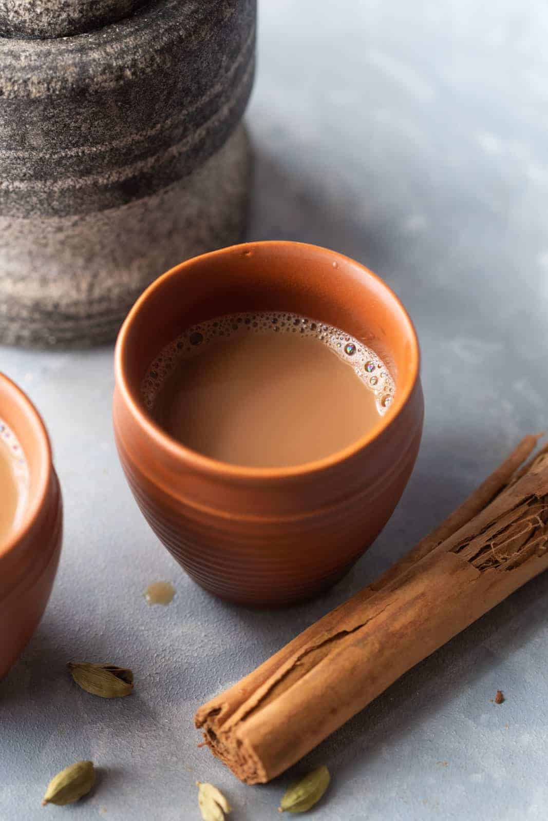 Masala Chai served in a terracota mug