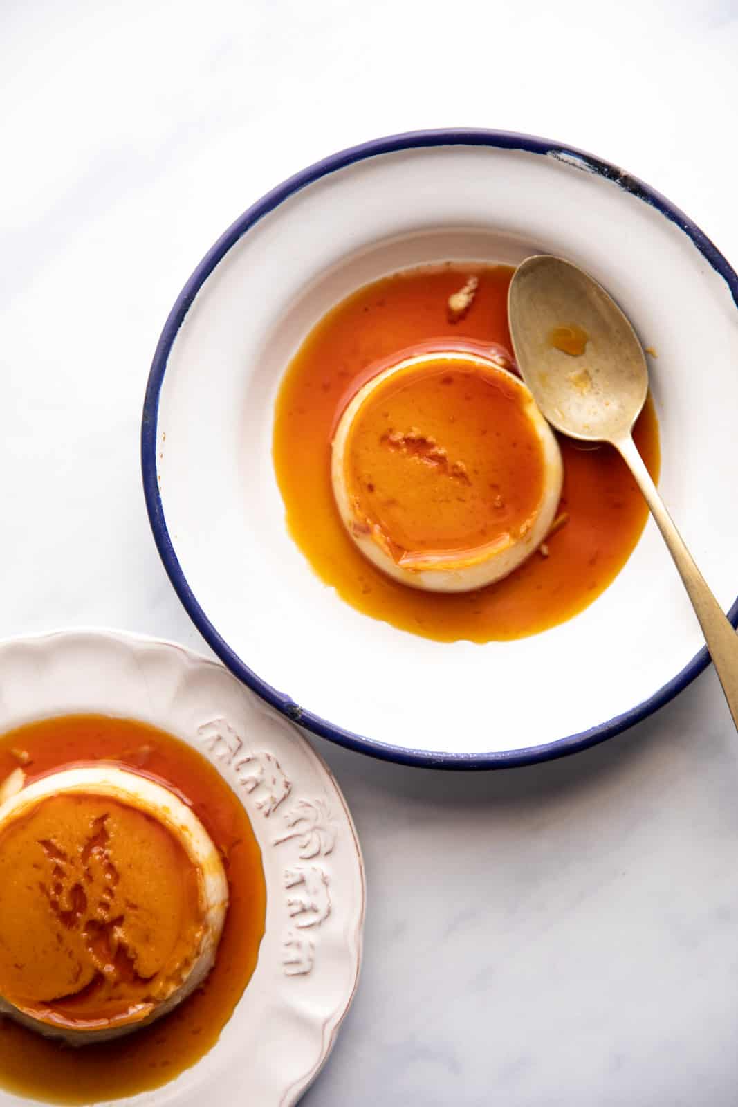 Overhead picture of two plates with coconut caramel custard ready to be served