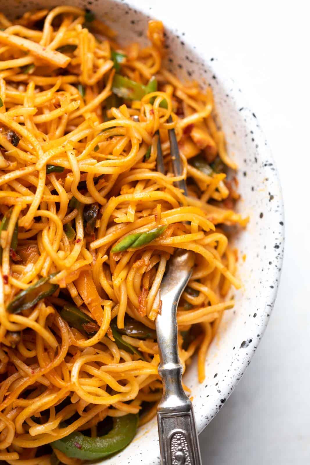 Picture of a fork with noodles twirled around it