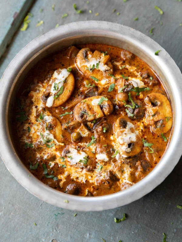 mushroom masala in a steel bowl ready for serving