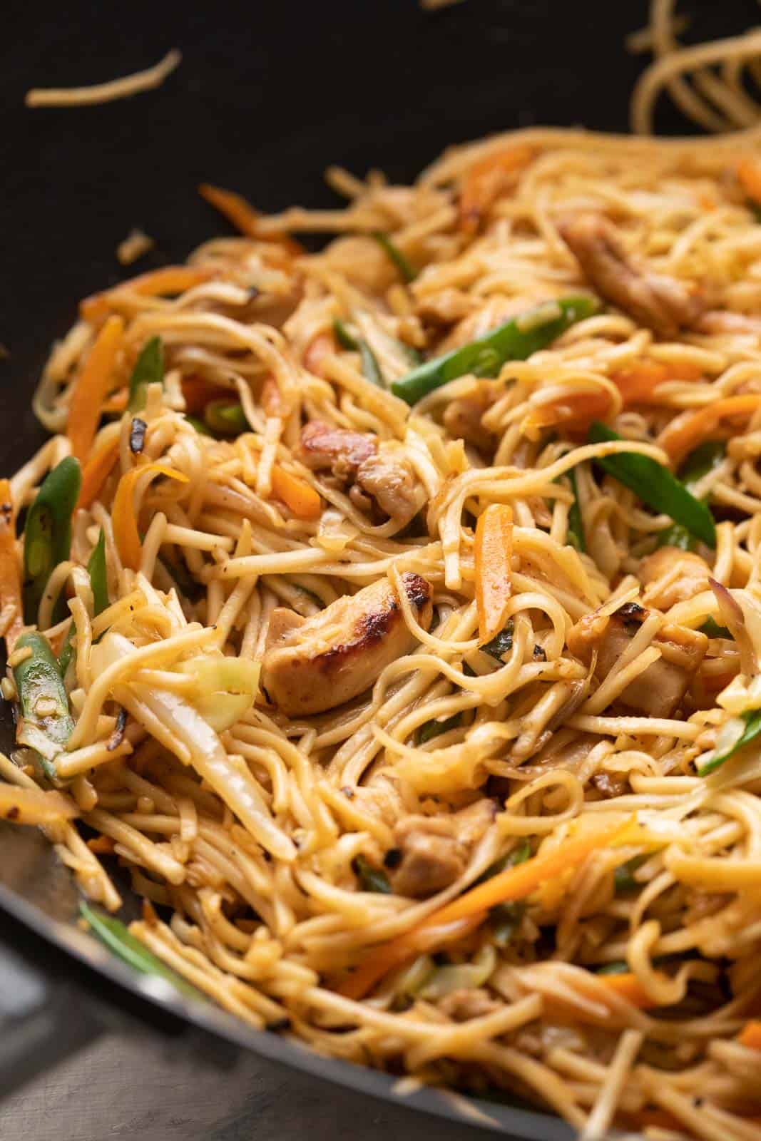 Chicken chow mein in the wok that it was stir fried in