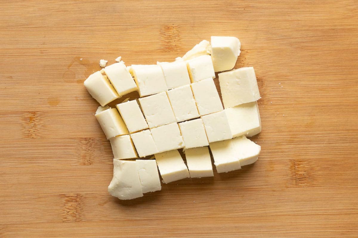 A slab of paneer cut into cubes