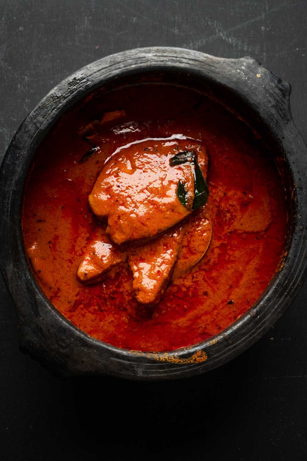 Fish curry in the mud pot that it was cooked in