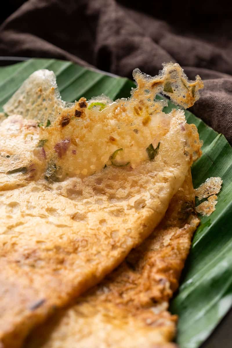 Closeup of oats dosas to show the crispy texture