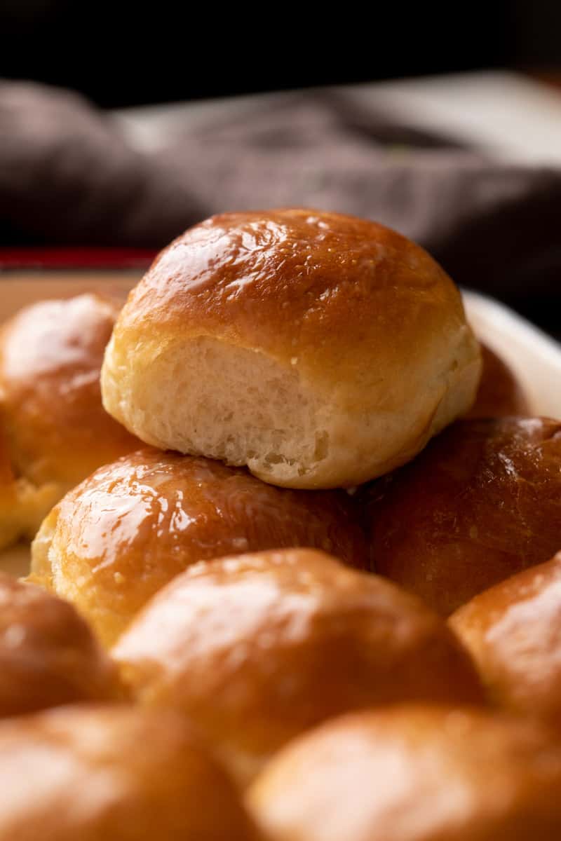 Single ladi pav stacked on top of other baked ladi pavs