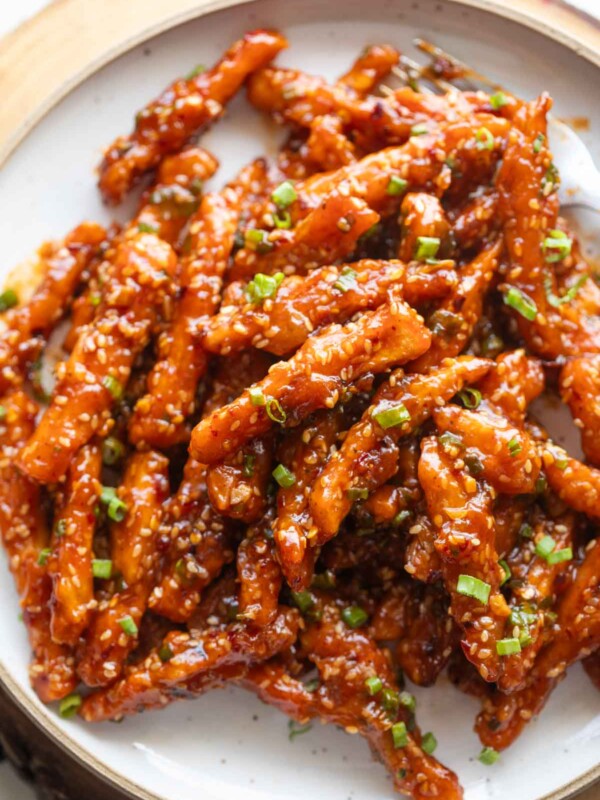 crispy honey chilli potatoes served on a white plate