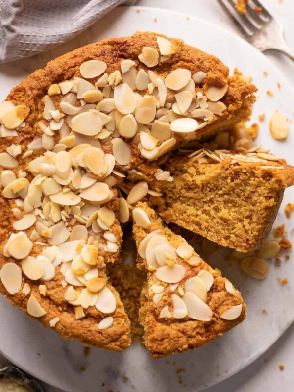 Mawa cake sliced and served on a white platter