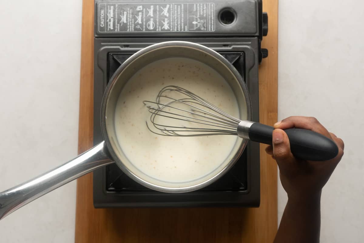 Picture showing whisking of milk to incorporate nutmeg