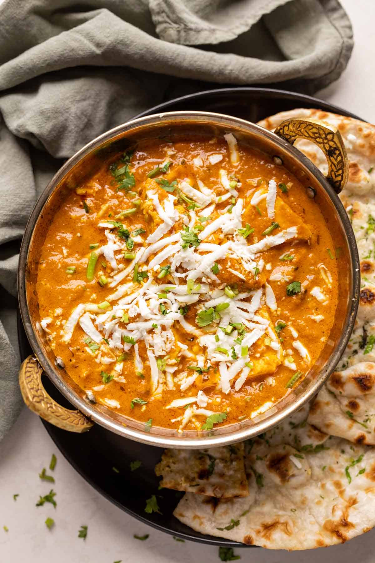 paneer lababdar in a kadhai with naan