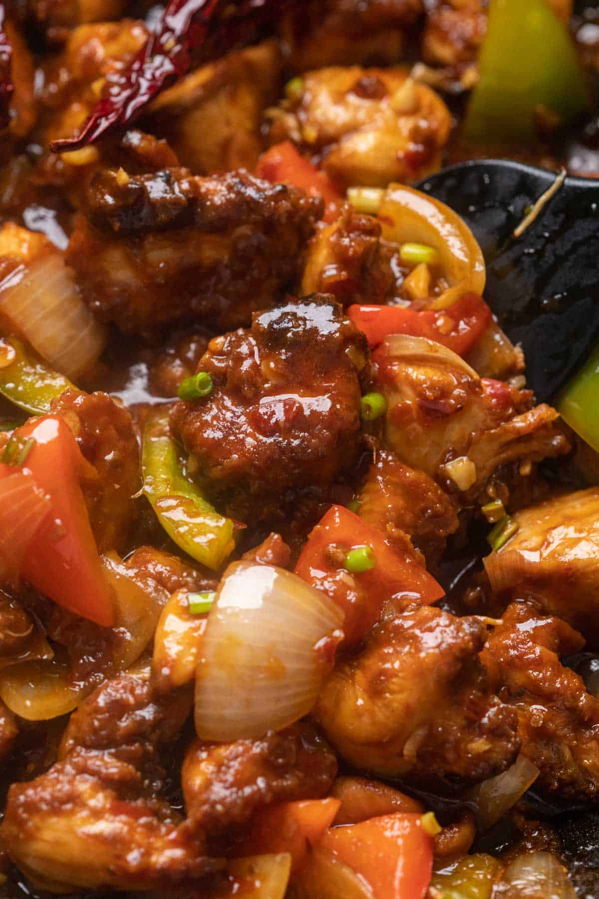 Close up of szechuan chicken in the wok