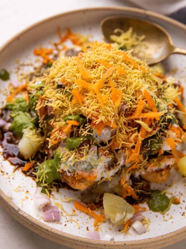 Bread Chaat served on a white plate with a spoon on the side