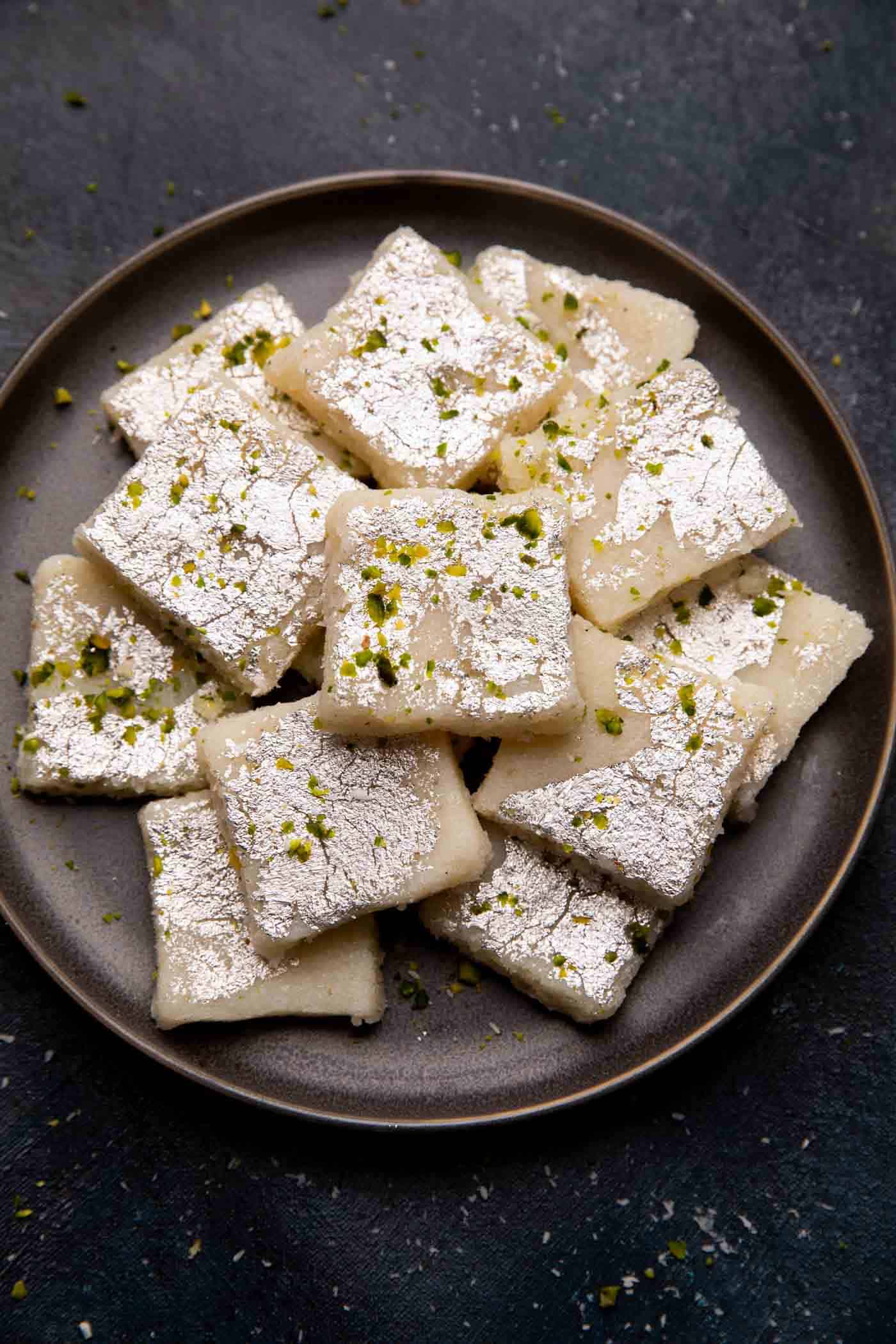 Coconut barfi served on a grey plate