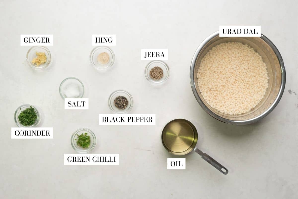 Picture of all the ingredients for medu vada with text overlay