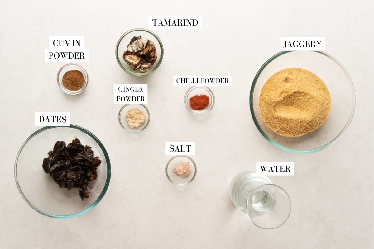 Picture of all the ingredients for tamarind chutney with text overlay