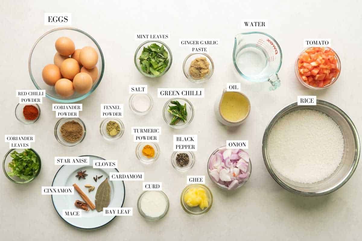 Picture of all the ingredients for egg biryani with text to identify them