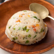 Upma served on a brown plate