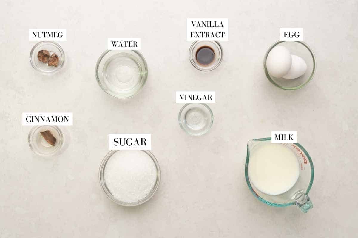 Picture of all the ingredients required for the Caramel Custard with text to identify them