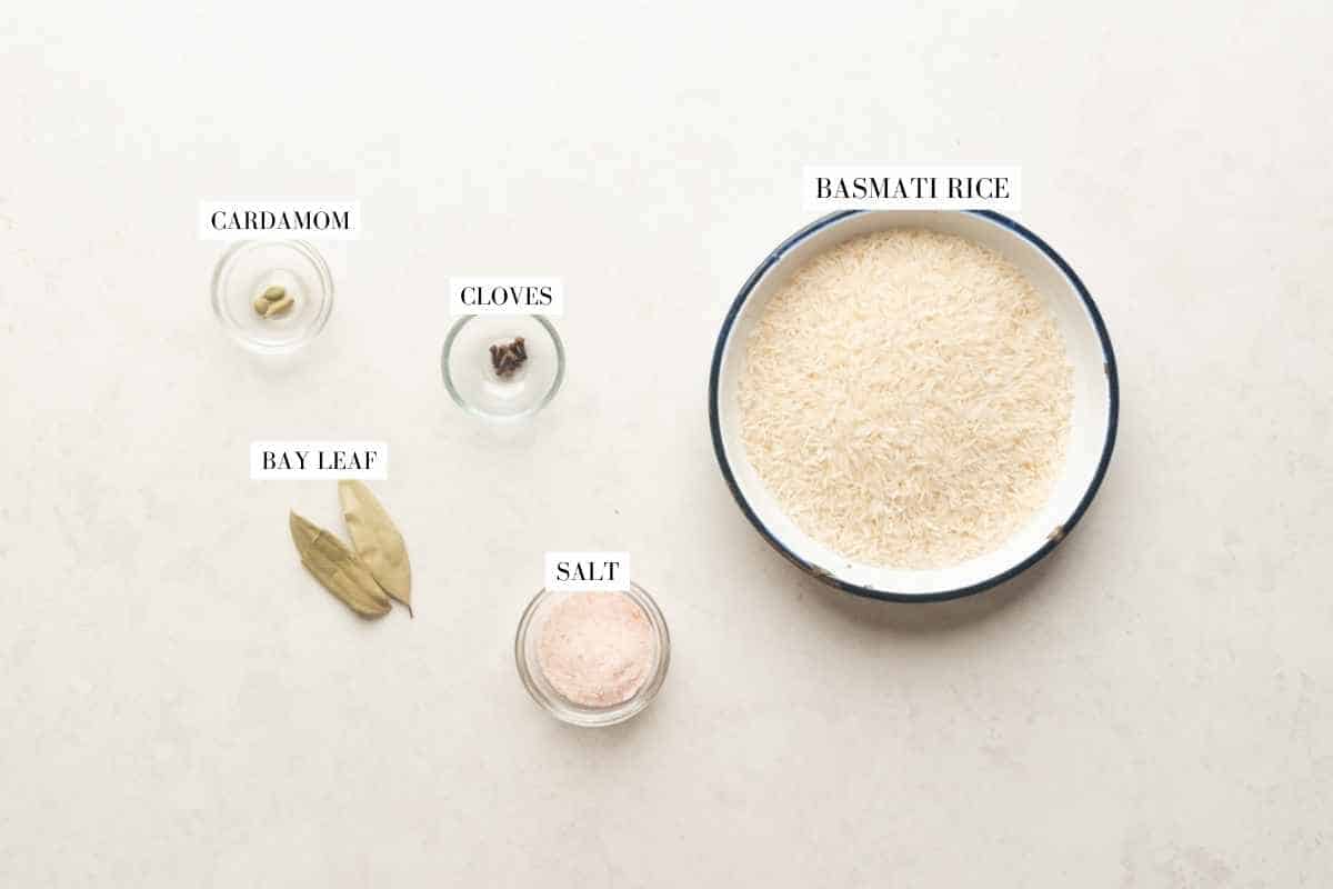 Picture of all the ingredients forInstant Pot Chicken Biryani with text to identify them