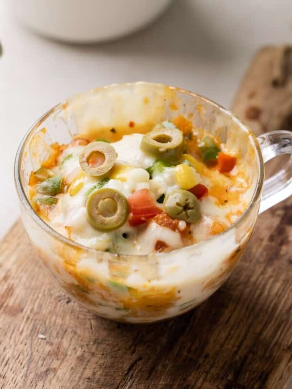 shot of microwave pizza in a mug