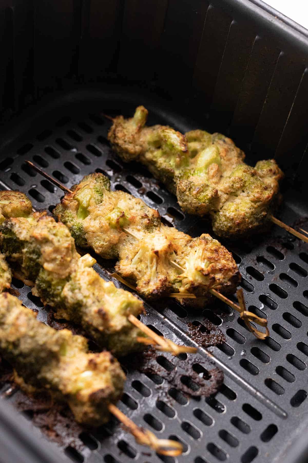 shot of malai broccoli on skewers in the air fryer