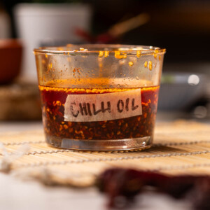 homemade chilli oil stored in a transparent, labelled container