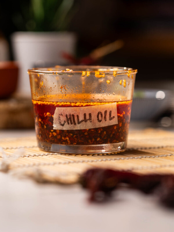 homemade chilli oil stored in a transparent, labelled container