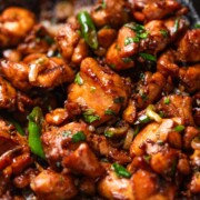 a close up image of ginger chicken stir fry to show it's juicy and crispy texture