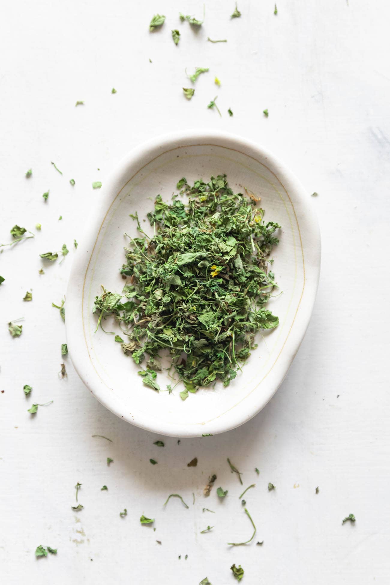 shot of kasuri methi on a white plate