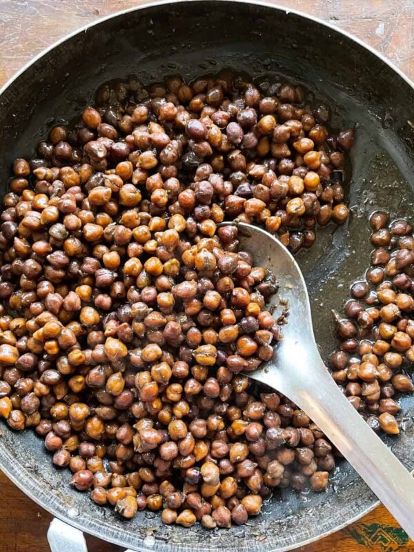 Kala chana pictured in the iron pan it was cooked in