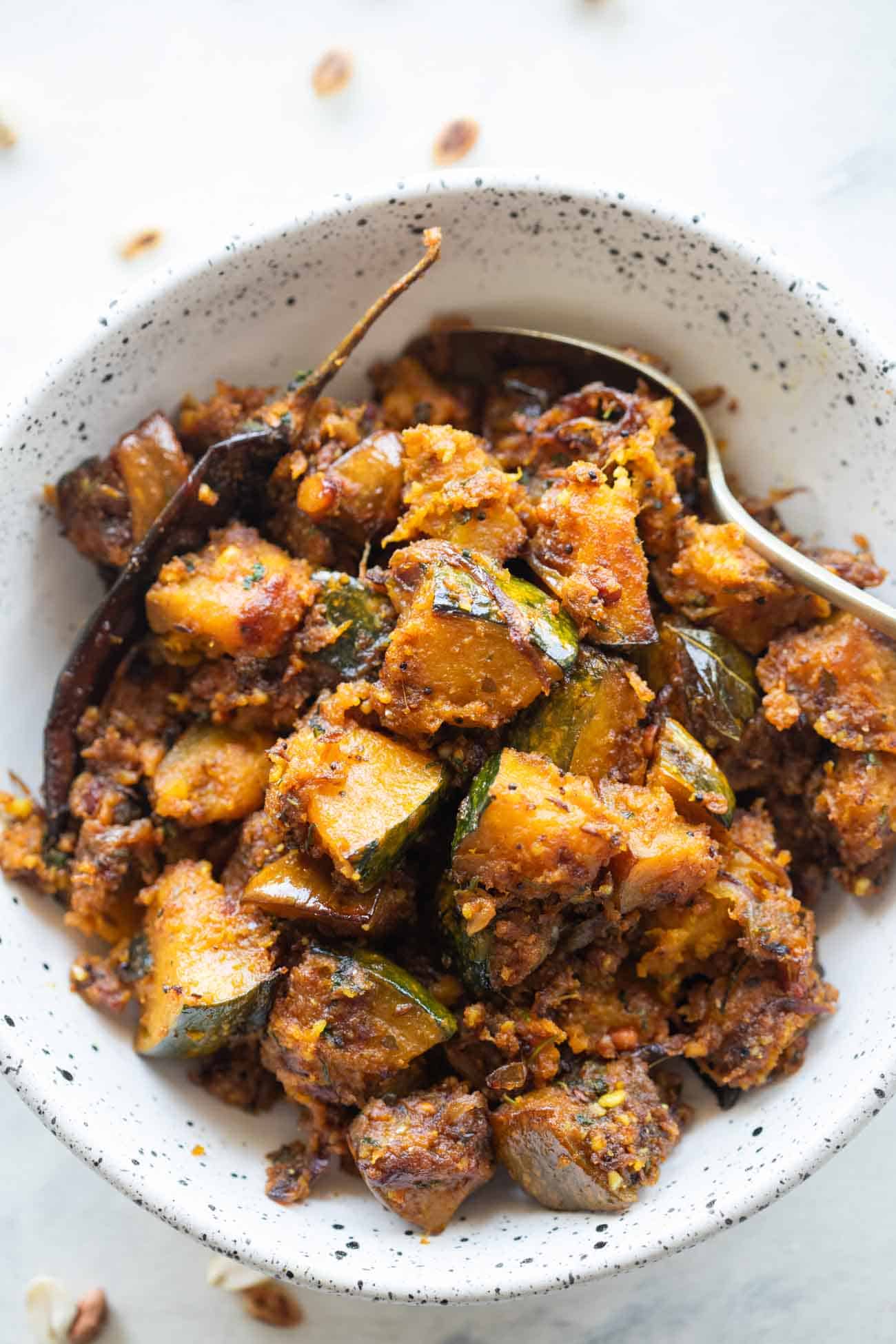 peanut pumpkin sabzi served in a white bowl