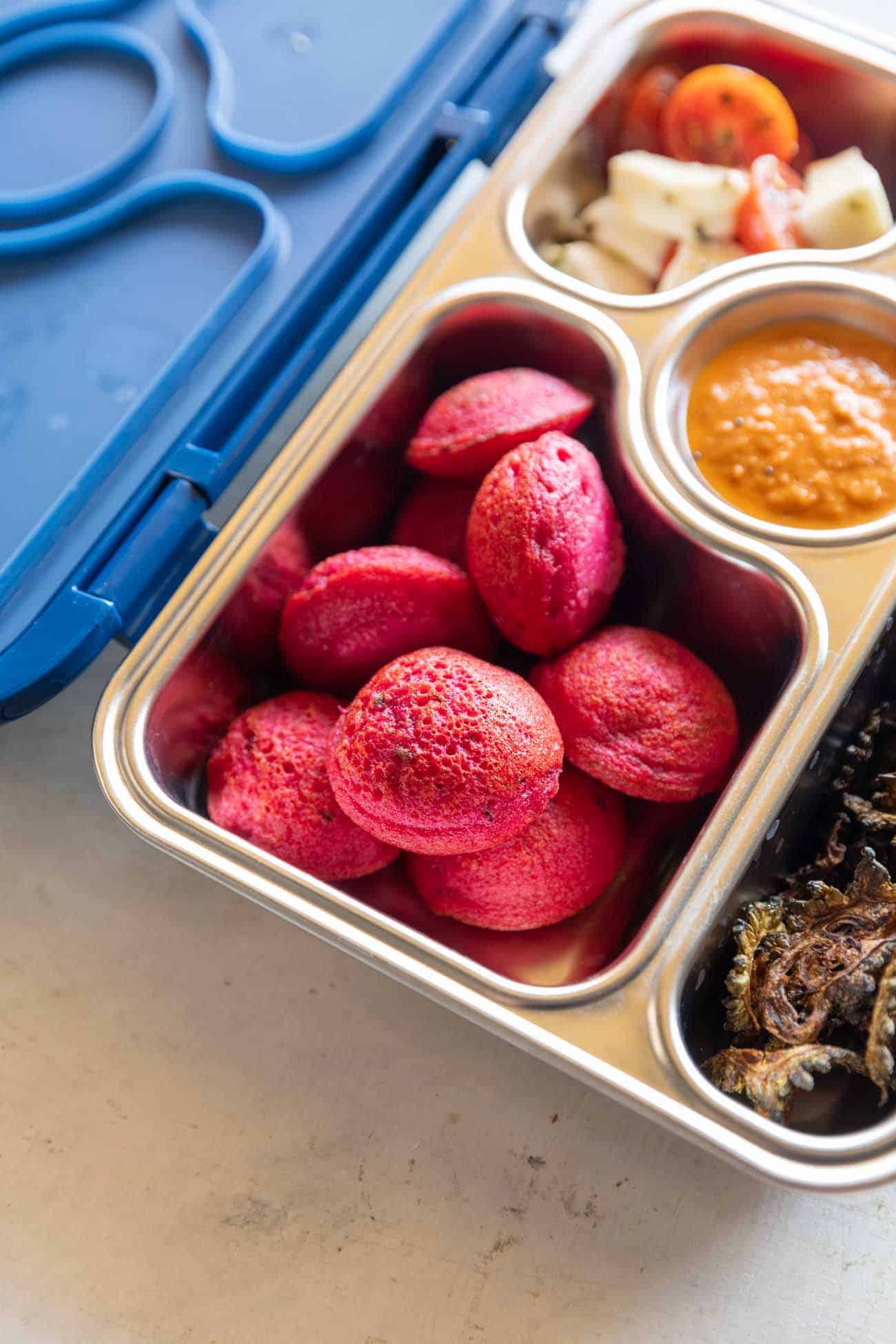 Beetroot paniyaram in a tiffin box