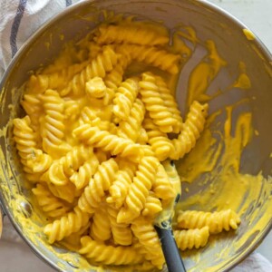 Carrot pasta sauce in a pann with a spatula