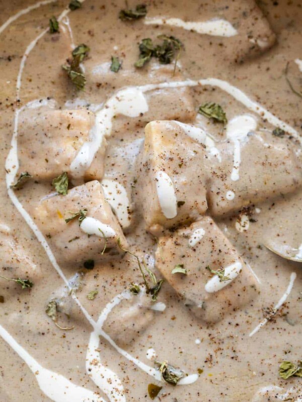 paneer kali mirch gravy served in a bowl with cream drizzled on top