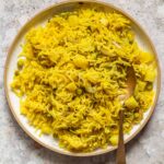 picture of tahari rice in a white plate with a steel spoon