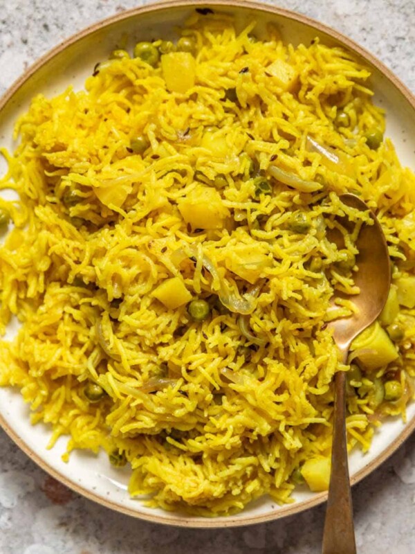 picture of tahari rice in a white plate with a steel spoon